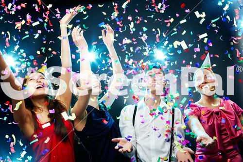 Four Friends Making Having Fun Among Confetti